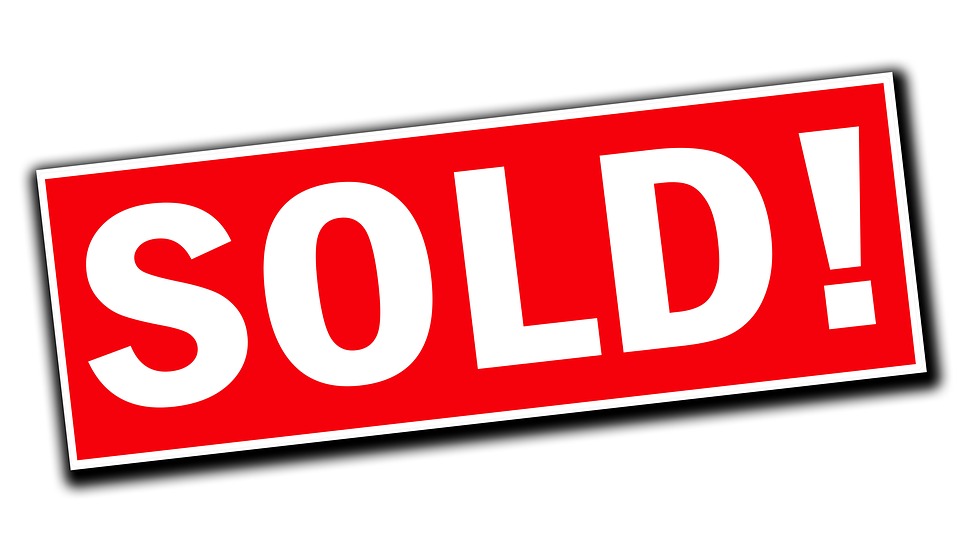 rred & white sold sign real estate copywriting image